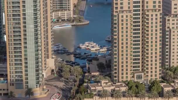 Aerial view of a road intersection between skyscrapers in Dubai marina timelapse. — Stock Video