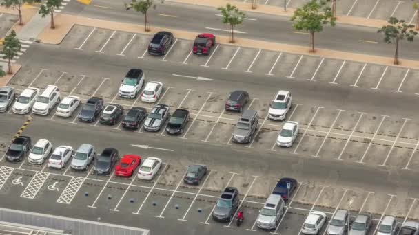 Big parking lot near mall crowded by many cars timelapse aerial view — Stock Video