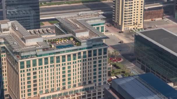 Hotels and office buildings in financial district in Dubai aerial timelapse — Stock Video