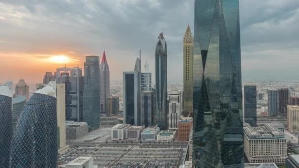Panorama of futuristic skyscrapers with sunset in financial district business center in Dubai on Sheikh Zayed road timelapse — Stock Video