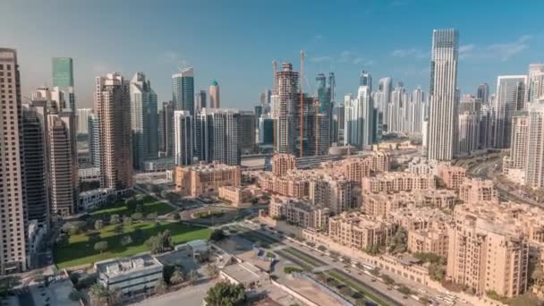 Dubais business bay towers aerial morning timelapse. Rooftop view of some skyscrapers — Stock Video