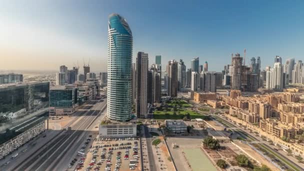 Panorama showing Dubais business bay towers aerial morning timelapse. Rooftop view of some skyscrapers — Stock Video