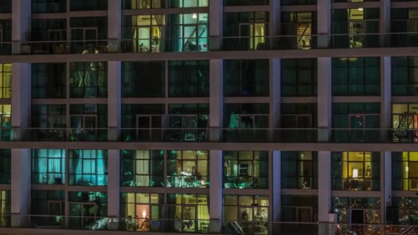 Big glowing windows in modern office and residential buildings timelapse at night — Stock Video