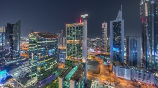 Διεθνές Οικονομικό Κέντρο Ντουμπάι ουρανοξύστες εναέρια νύχτα timelapse. — Αρχείο Βίντεο