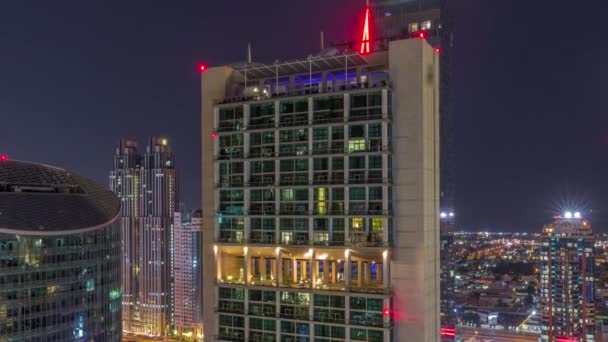 Dubai internationella finansiella centrum skyskrapor antenn hela natten timelapse. — Stockvideo