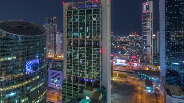 Dubai international financial center skyscrapers aerial all night timelapse. — Stock Video