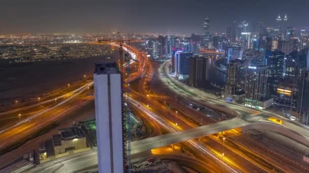 Skyline with modern architecture of Dubai business bay towers night timelapse. Aerial view — Stock Video
