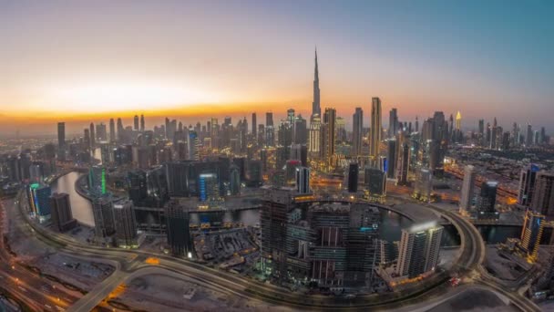 Panoramic skyline of Dubai with business bay and downtown district day to night timelapse. — Stock Video