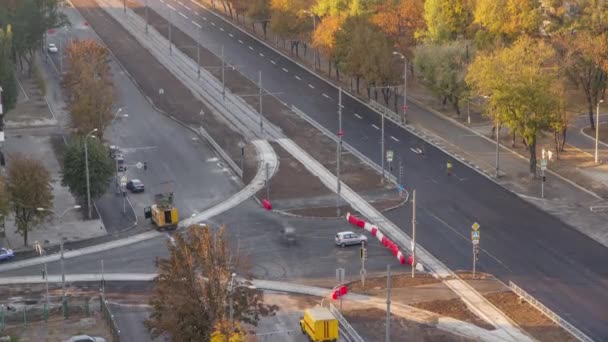 Construction site of avenue with asphalt paver, roller and truck aerial timelapse. — стоковое видео