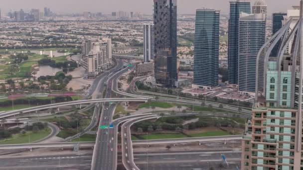Huge highway crossroad junction between JLT district and Dubai Marina aerial day to night timelapse. — Stock Video