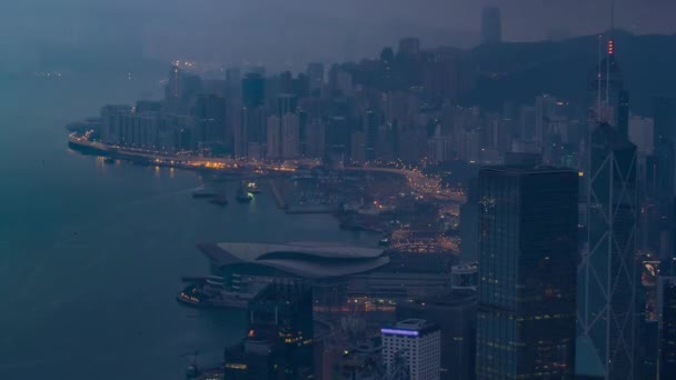 La famosa vista di Hong Kong da Victoria Peak notte per giorno timelapse. — Video Stock