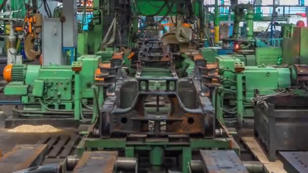 Conveyor assembly stage the body of tractor at big industrial factory timelapse — Stock Video