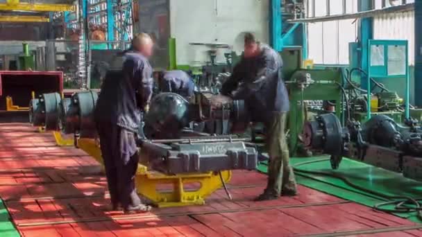 Conveyor assembly stage the body of tractor at big industrial factory timelapse — Stock Video