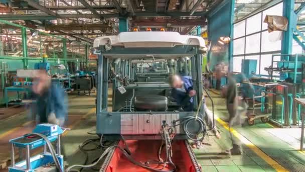 Conveyor assembly stage the body of tractor at big industrial factory timelapse — Stock Video