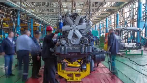 Conveyor assembly stage the body of tractor at big industrial factory timelapse — Stock Video