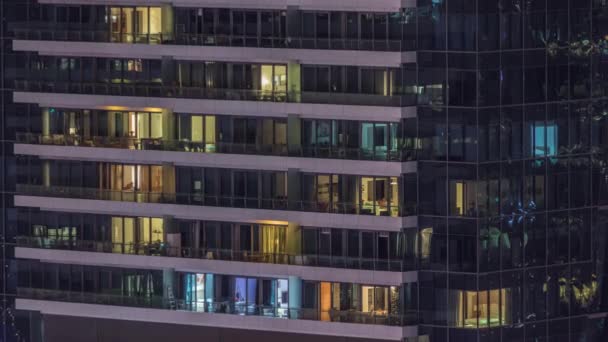 Windows lights in modern residential buildings timelapse at night — Stock Video