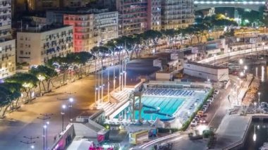 Deniz Yüzme havuzunda Monaco gece timelapse, binalar içinde belgili tanımlık geçmiş.