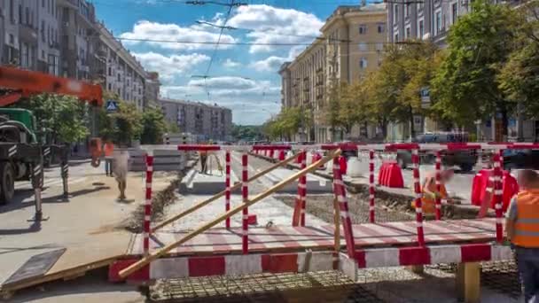 Orange construction telescopic mobile crane moving small pedestrian bridge timelapse. — Stock Video