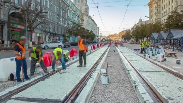 Tram rails at the stage of their installation and integration into concrete plates on the road timelapse. — Stock Video