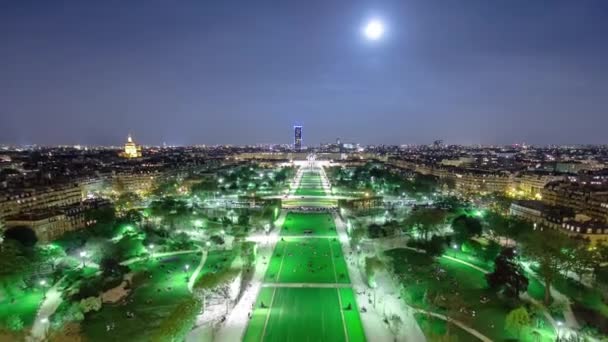 Champs de Mars from the Eiffel tower at night with rising Moon timelapse — Stock Video