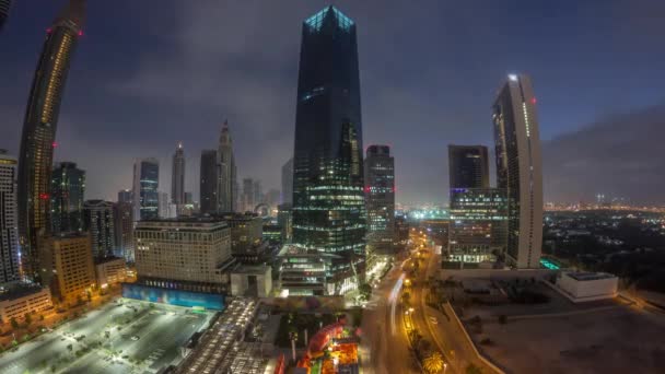Panorama do Dubai International Financial distrito aéreo noite a dia timelapse. Vista de torres de escritório de negócios. — Vídeo de Stock