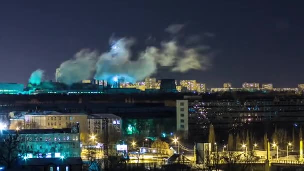 Pipes with smoke and residential apartment buildings night timelapse. — Stock Video