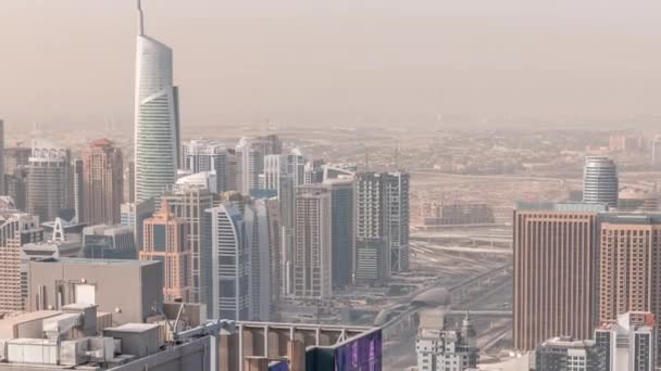 Dubai Marina and JLT district with traffic on highway between skyscrapers aerial timelapse. — Stock Video