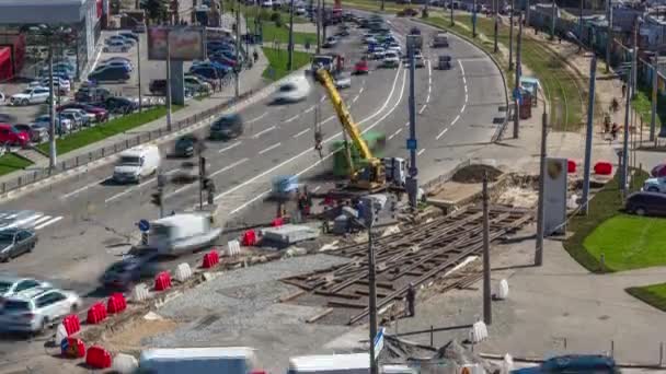 Installing concrete plates by crane at road construction site timelapse. — Stock Video