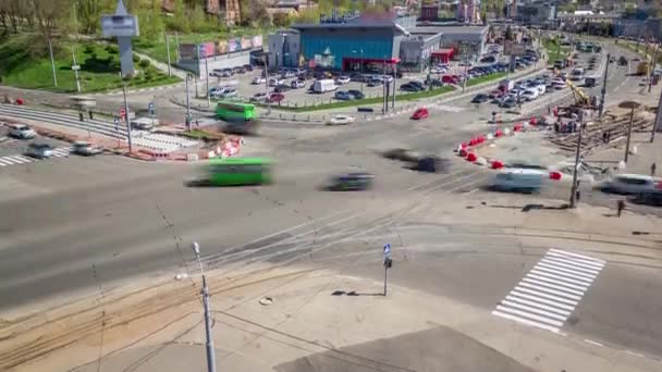 Installing concrete plates by crane on intersection at road construction site timelapse. — Video