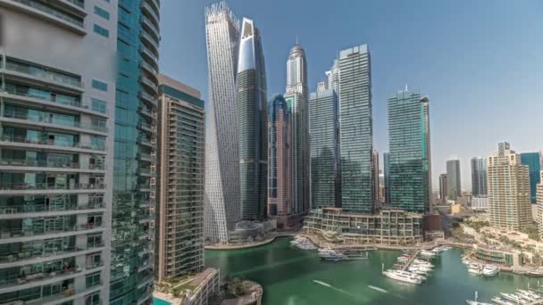 Panorama showing Dubai marina tallest skyscrapers and yachts in harbor aerial timelapse. — Vídeo de Stock