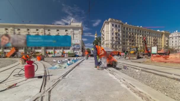 Tram rails at the stage of their installation and integration into concrete plates on the road timelapse — Stock Video