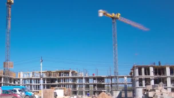 Large construction site with buildings under construction and multi-storey residential homes timelapse hyperlapse. — Stockvideo