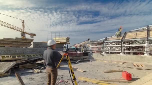 Construction worker using theodolite surveying optical instrument timelapse. — Stockvideo