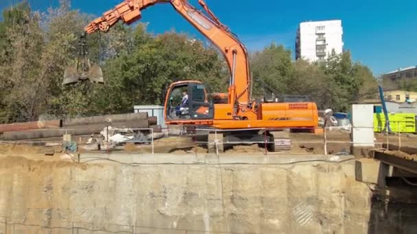 Huge ditch pit at the construction site of the underground metro station line timelapse. — Stok video