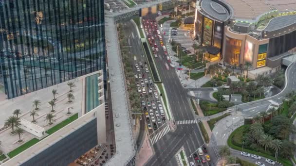 Aerial panorama of Downtown Dubai with shopping mall and traffic on a street day to night timelapse from above, UAE — Vídeo de Stock