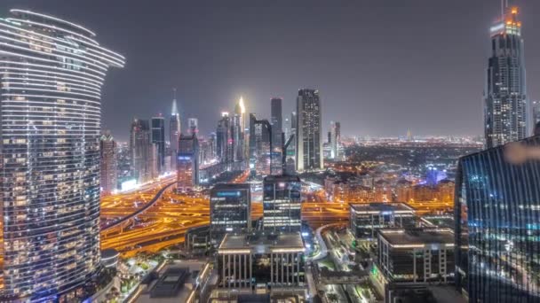 Futurista Dubai Downtown e área financeira skyline aéreo durante toda a noite timelapse. — Vídeo de Stock