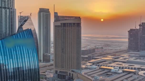 Aerial sunrise panorama of Downtown Dubai with shopping mall and traffic on a street timelapse from above, UAE — Stock Video