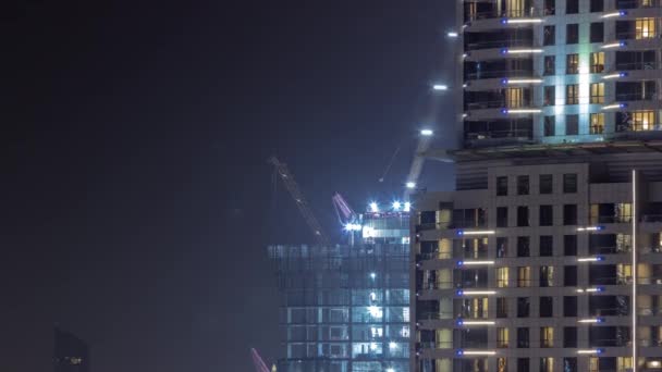 Höga Byggnader Uppbyggnad Och Kranar Centrum Natten Timelapse Arbete Pågår — Stockvideo