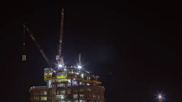 Proces Budowy Kompleksu Mieszkalnego Powietrza Nocy Timelapse Wiele Wieżowców Tle — Zdjęcie stockowe