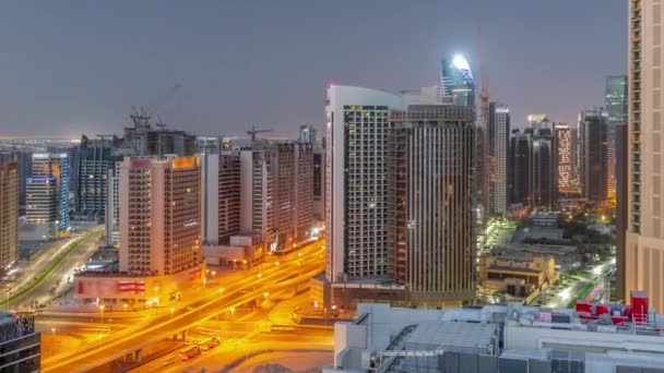 Rascacielos Bahía Negocios Dubai Noche Aérea Día Timelapse Transición Intersección — Vídeos de Stock