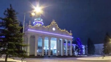 Old terminal of Kharkiv international airport after renovation serves as VIP zone winter night timelapse hyperlapse. Snow and ice in front of it