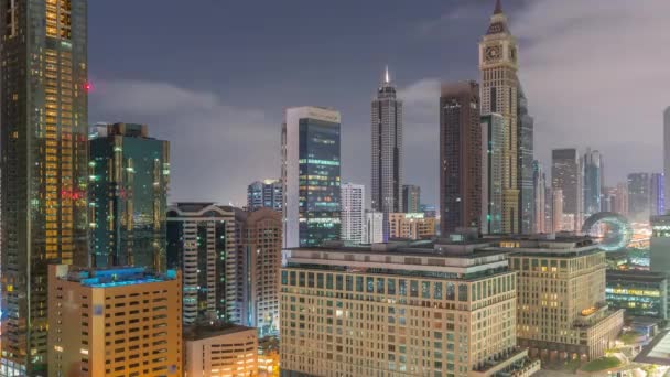 Dubai International Distrito Financiero Noche Día Timelapse Transición Vista Aérea — Vídeos de Stock