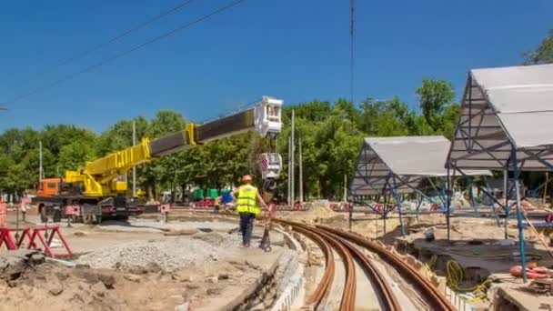 Yellow Construction Telescopic Mobile Crane Moving Tram Rails Concrete Plates — Stock Video