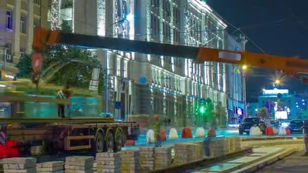 Orange Construction Telescopic Mobile Crane Unloading Tram Rails Truck Night — Video