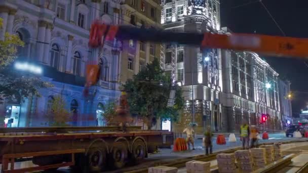 Orange Construction Telescopic Mobile Crane Unloading Tram Rails Truck Night — 비디오