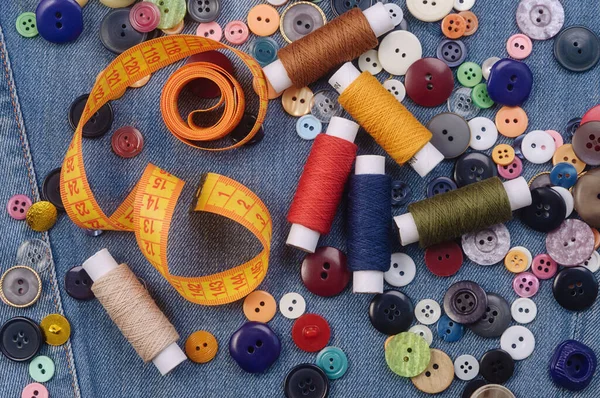 Pile Multicolored Sewing Buttons Yellow Measuring Tape Thread Spools Denim — Stock Photo, Image