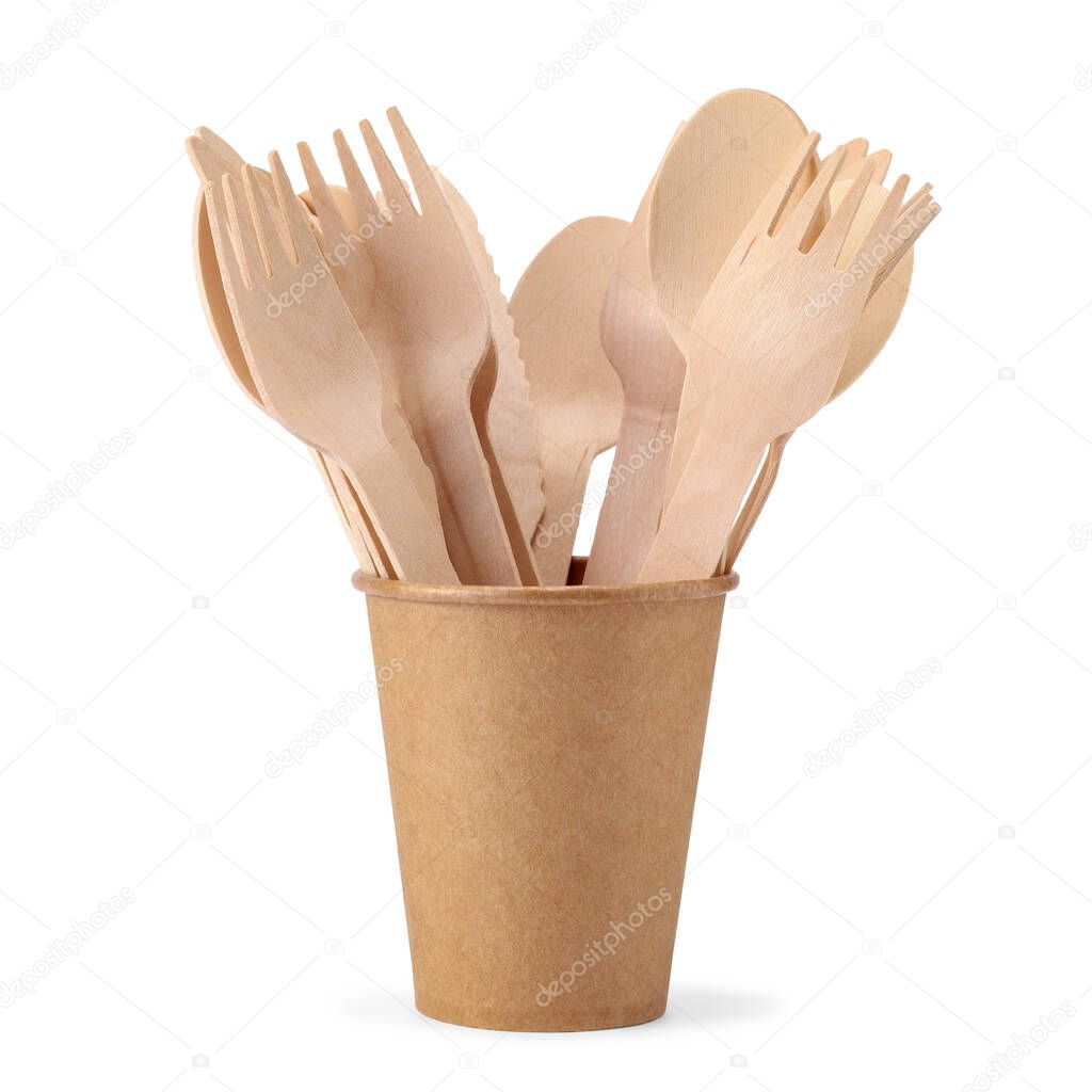 Disposable paper cup with wooden forks and spoons isolated on white background. Eco friendly disposable tableware from natural material.