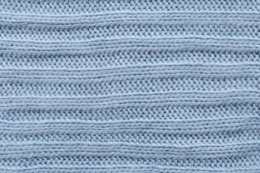 Mavi tekstil dokusunu kapat. Yünlü örgü kumaş arka plan. Detaylı sıcak yün ceket.