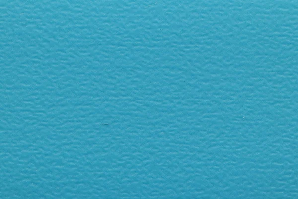 Texture of blue PVC plastic for edging chipboard ends. Decorative blue background texture.