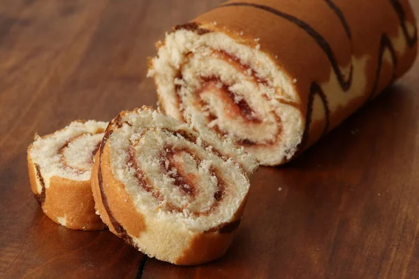 Sponge Cake Roll Strawberry Filling Wooden Background Dessert Biscuit Roll — Stockfoto